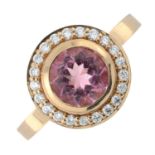 An 18ct gold pink tourmaline and diamond cluster ring.