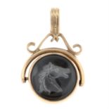 A 9ct gold onyx and rock crystal swivel fob, with reverse carved horse head.