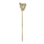 An early 20th century 9ct gold split pearl Irish harp stickpin.