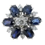 A sapphire and diamond cluster ring.