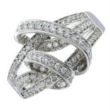 A brilliant-cut diamond scrolled dress ring.