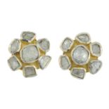 A pair of polki diamond cluster earrings.