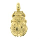 A scarab beetle pendant.