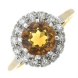 An 18ct gold citrine and diamond cluster ring.