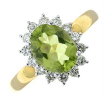 An 18ct gold peridot and diamond cluster ring.
