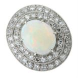 An opal cabochon and brilliant-cut diamond dress ring.