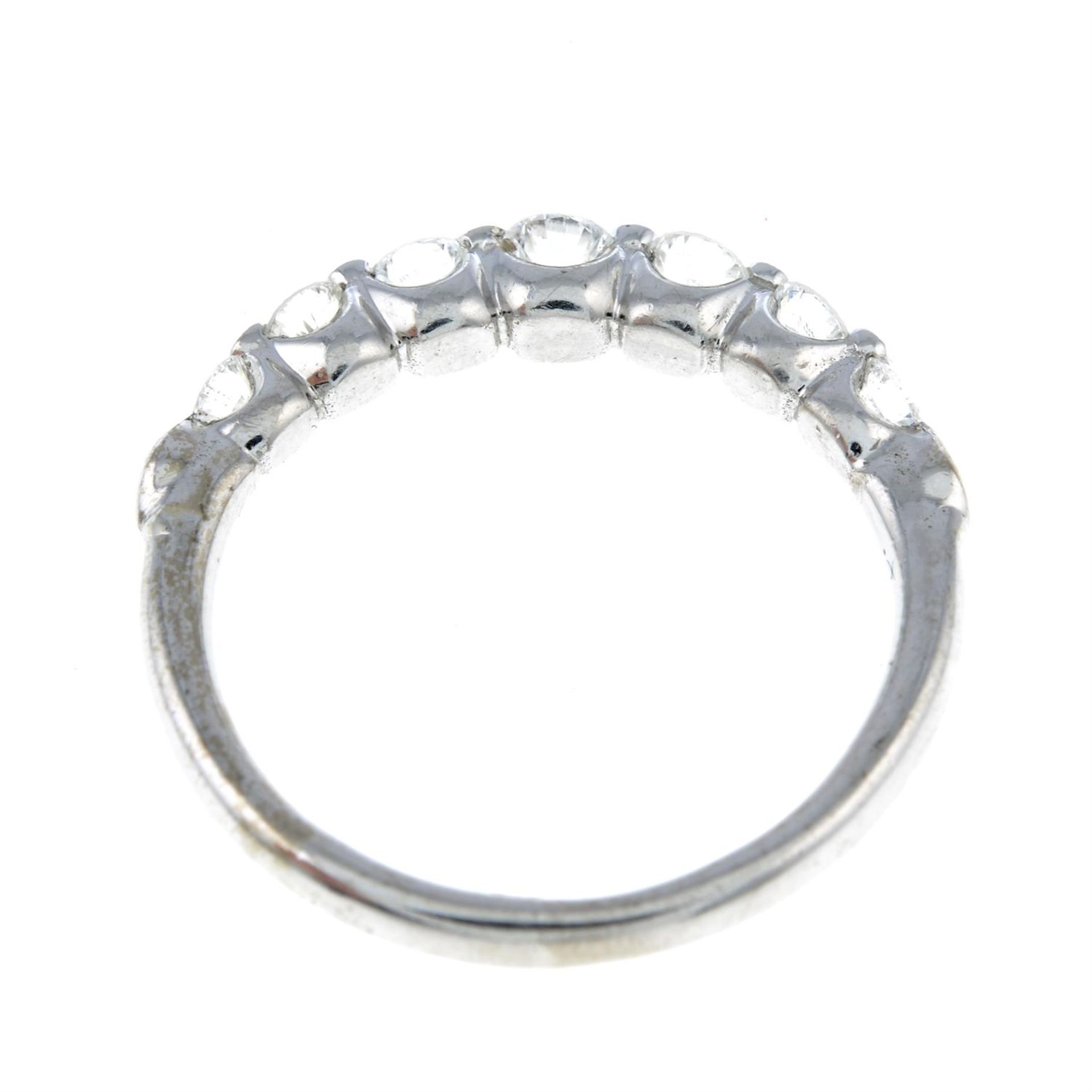 An 18ct gold brilliant-cut diamond seven-stone ring, with diamond spacers. - Image 2 of 2