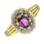 An 18ct gold ruby and diamond cluster ring.