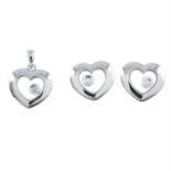 A 9ct gold heart-shape free-moving diamond pendant, together with a pair of matching earrings.