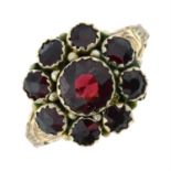 An Edwardian 9ct gold garnet cluster ring.