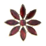 A late Georgian gold foil-back garnet floral brooch.