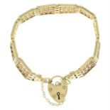 A 9ct gold fancy-link bracelet, with heart-shape padlock clasp.