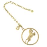 A handbag charm, depicting a galloping horse.