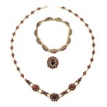 A garnet necklace, bracelet and ring suite.