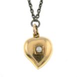 An early 20th century split pearl accent heart locket pendant, on an integral chain,