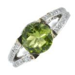 A peridot and brilliant-cut diamond dress ring.