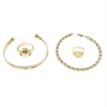 (69244) Two 9ct gold rings, a 9ct gold bracelet and a bangle.