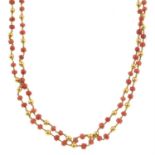 A late 19th century coral and gold bead two-row necklace.