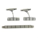 A pair of cufflinks, together with a matching tie slide, by Henry Pilstrup for Georg Jensen.