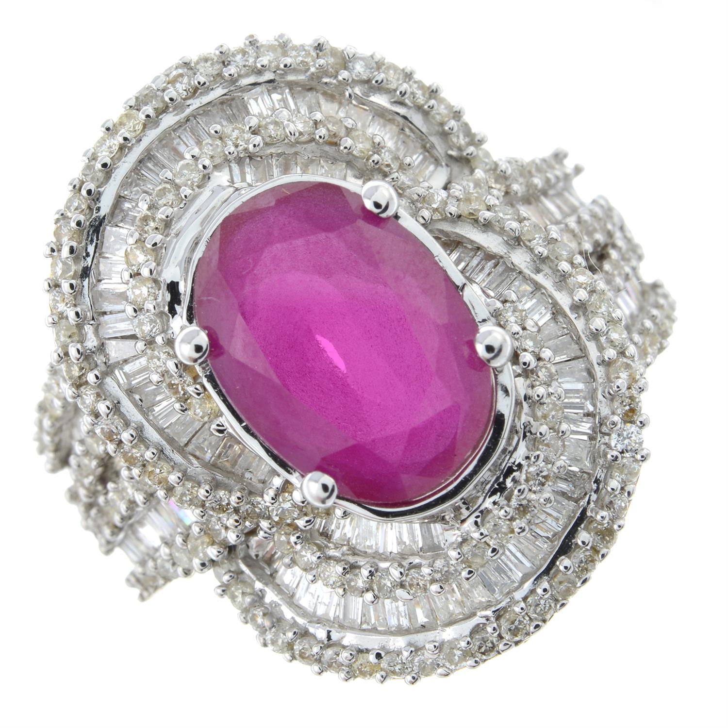 A synthetic ruby and vari-cut diamond dress ring.