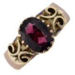 An Edwardian 9ct gold garnet single-stone ring.