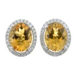 A pair of 18ct gold citrine and diamond cluster earrings.