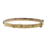 A late 19th century gold buckle bangle.