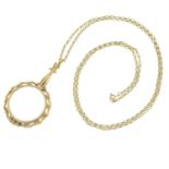 A 9ct gold magnifying glass pendant, with chain.