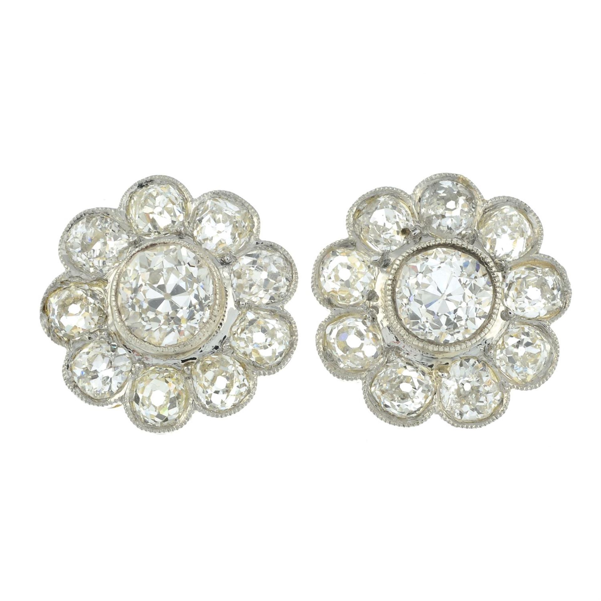A pair of old-cut diamond cluster earrings.