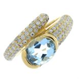 An oval-shape aquamarine and diamond ring.