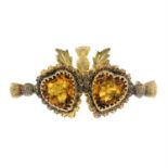 A late Victorian 9ct gold orange paste twin-heart and Scottish thistle motif brooch.