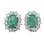 A pair of 18ct gold emerald and diamond cluster earrings.