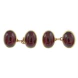 A pair of 1970s 9ct gold garnet oval-shape cufflinks.