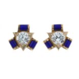 A pair of late 19th century blue enamel and colourless paste stud earrings.