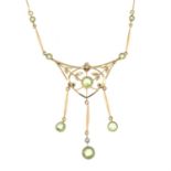 A peridot and seed pearl pendant, in an integral trace-link chain.