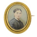 A late 19th century gold portrait brooch.