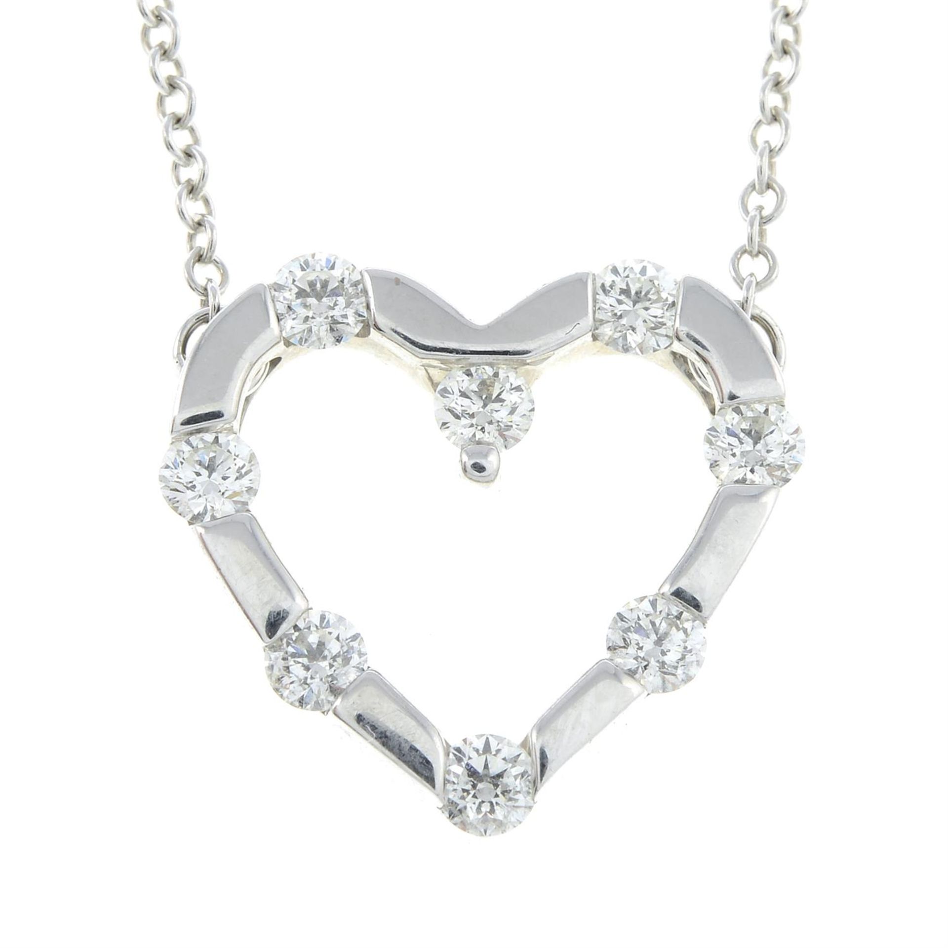 An 18ct gold brilliant-cut diamond openwork heart pendant, with integral chain.