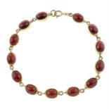 A 9ct gold garnet cabochon bracelet.