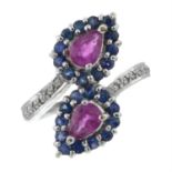 A 9ct gold ruby, sapphire and diamond crossover ring.