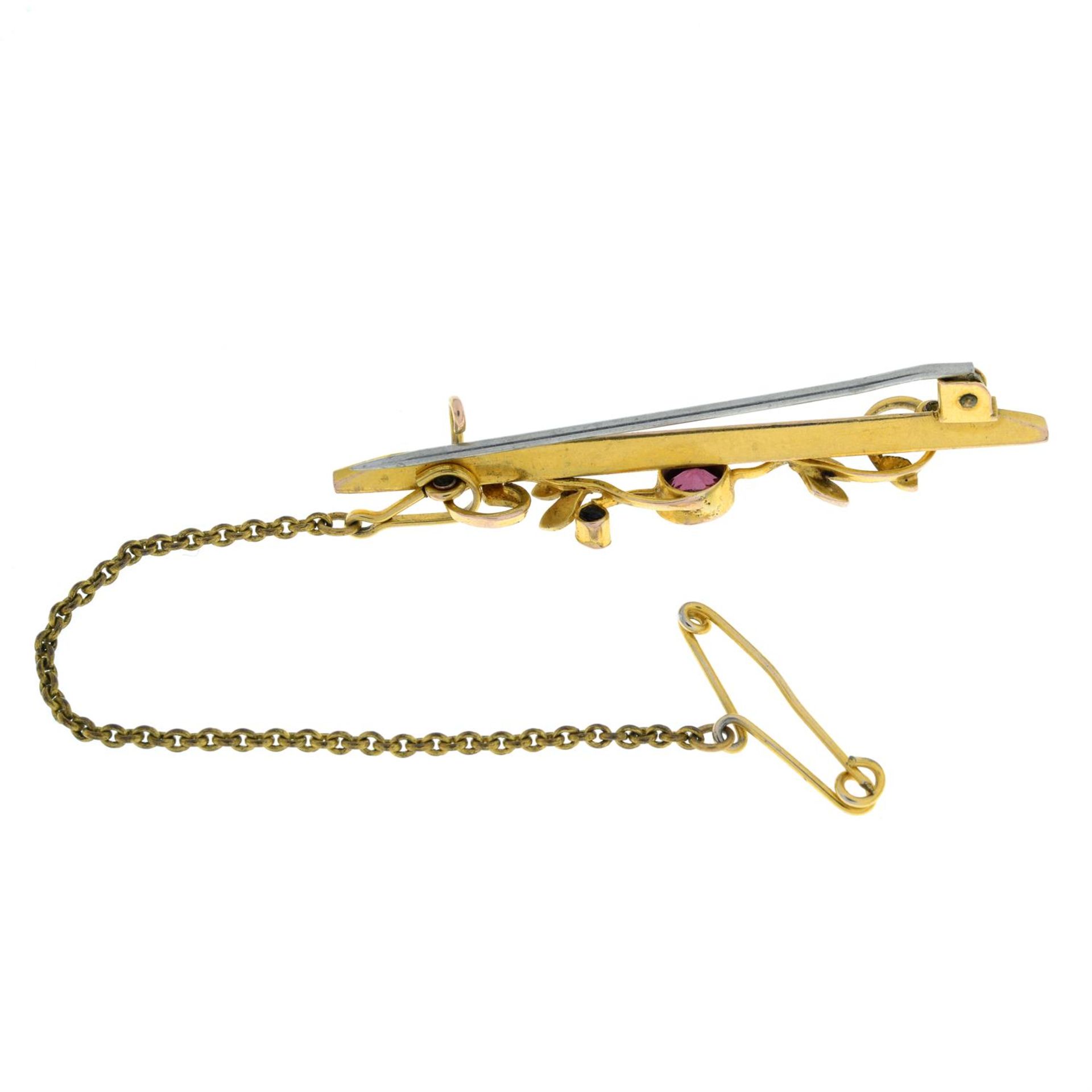 An early 20th century 9ct gold garnet and split pearl bar brooch. - Image 2 of 2