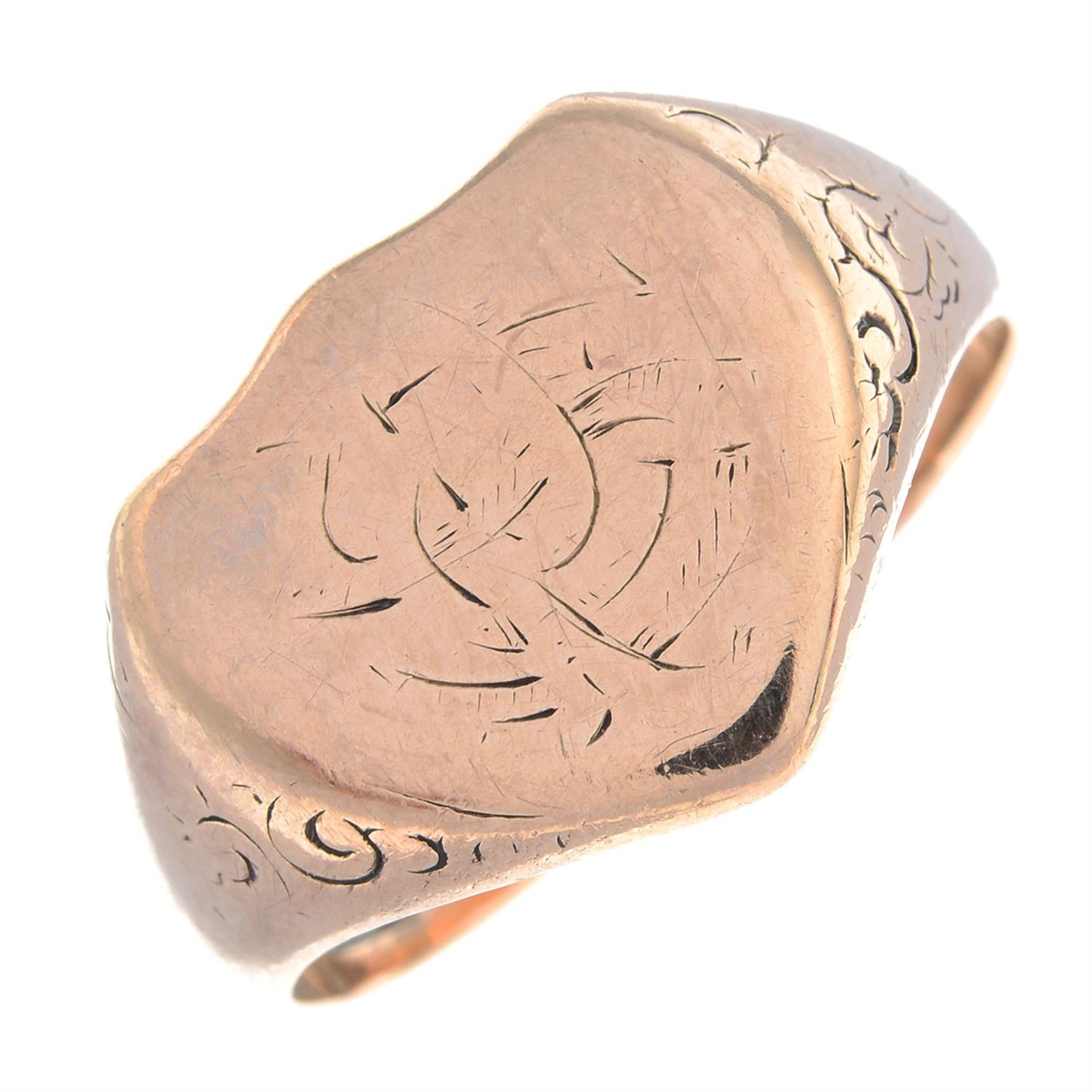 An early 20th century shield-shape signet ring, with scrolling sides.