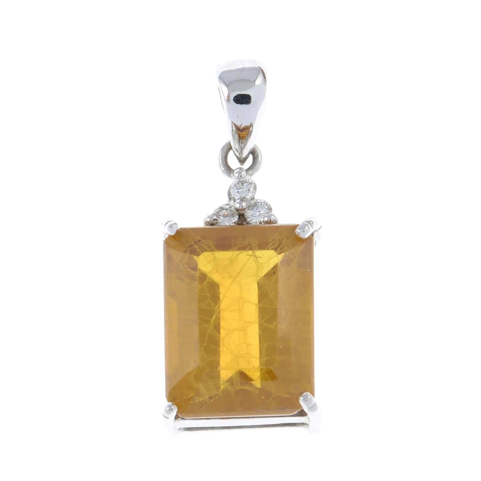 A synthetic yellow sapphire and diamond pendant.
