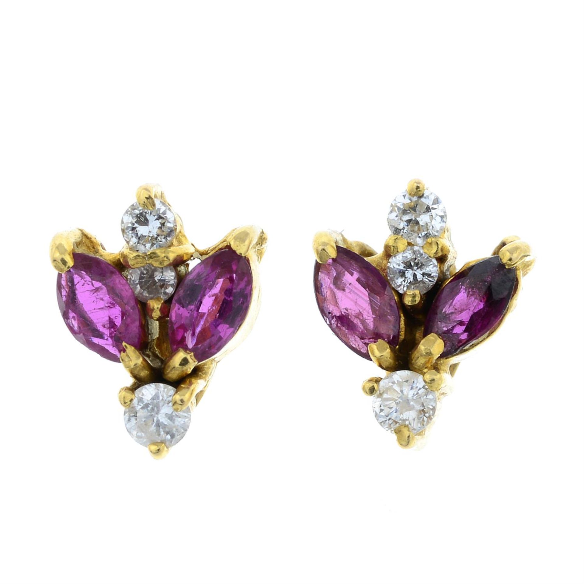 A pair of ruby and diamond earrings.