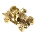 A 9ct gold vintage car pendant.