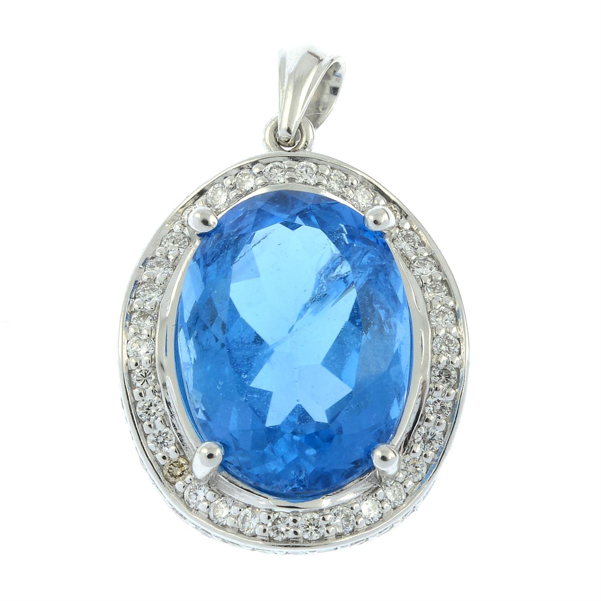 A blue topaz and diamond pendant.