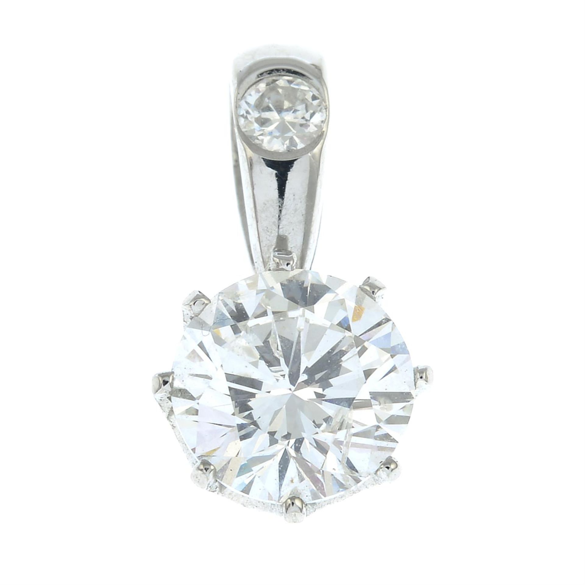 A platinum brilliant-cut diamond single-stone pendant, with diamond accent surmount.