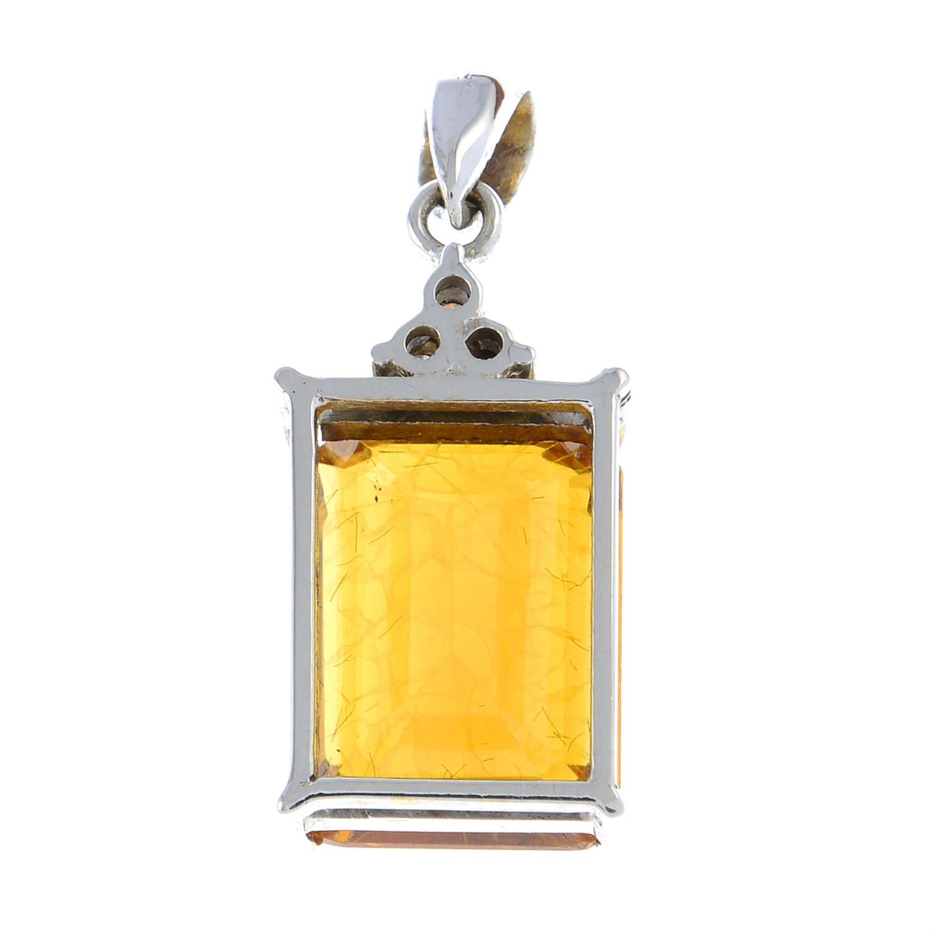 A synthetic yellow sapphire and diamond pendant. - Image 2 of 2