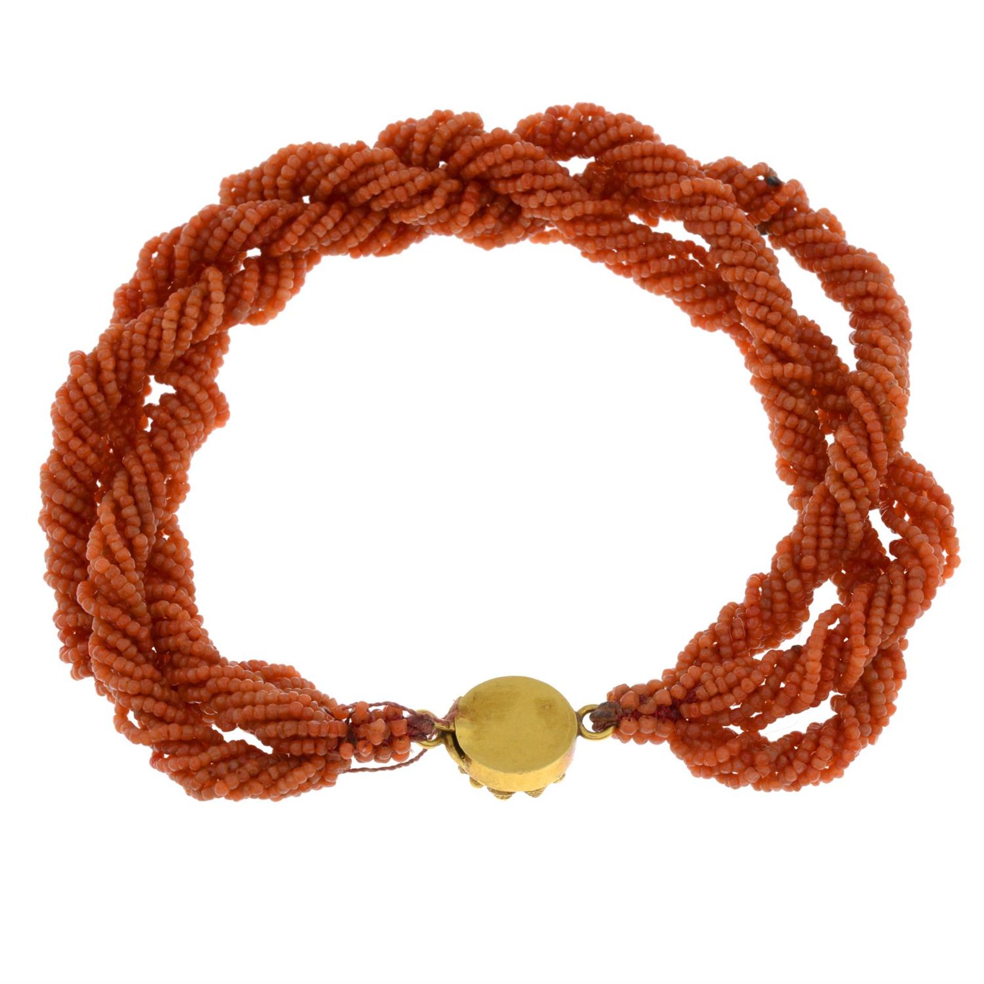 An early 20th century multi-row coral bracelet, with cannetille push-piece clasp. - Image 2 of 2