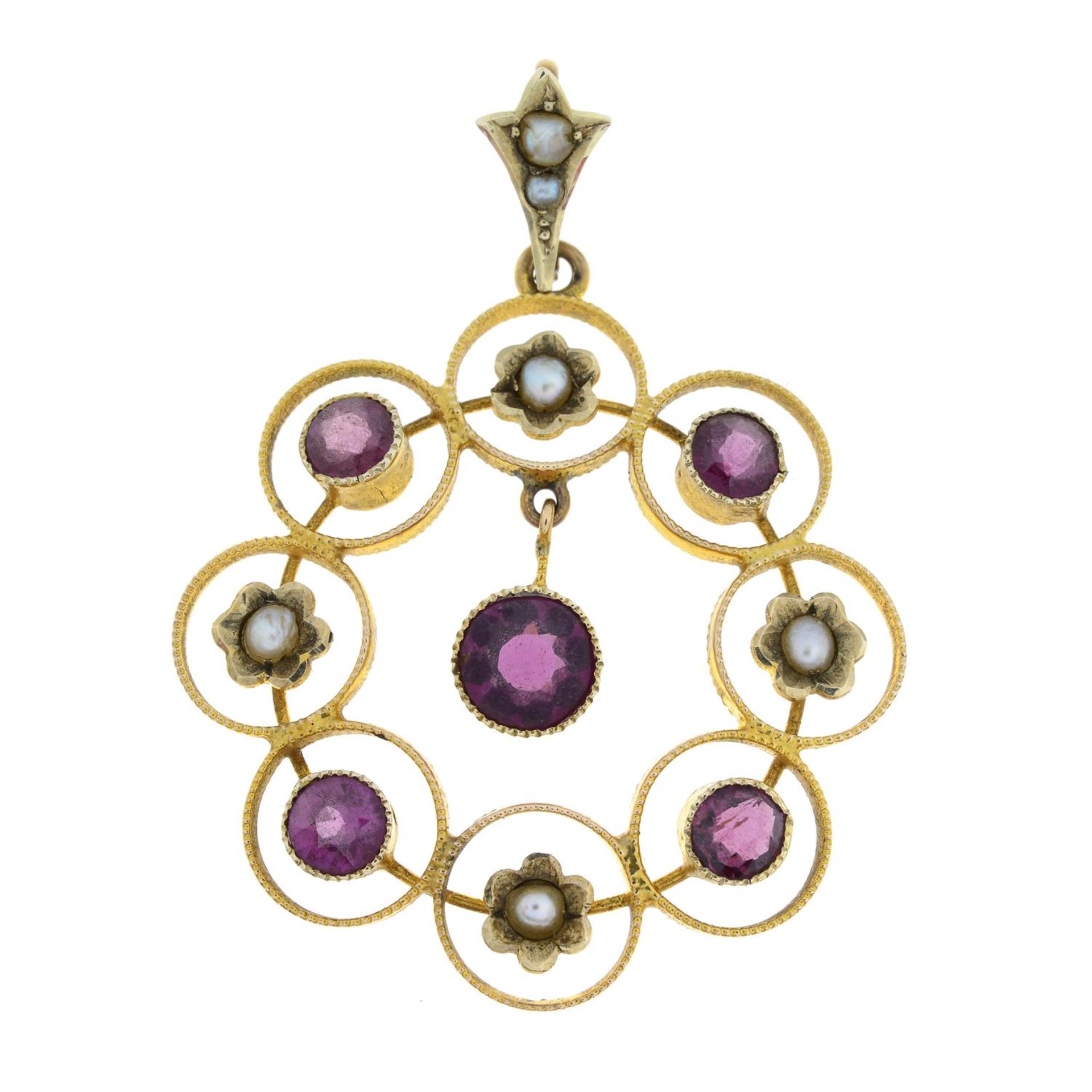 An early 20th century 9ct gold garnet and seed pearl openwork pendant.