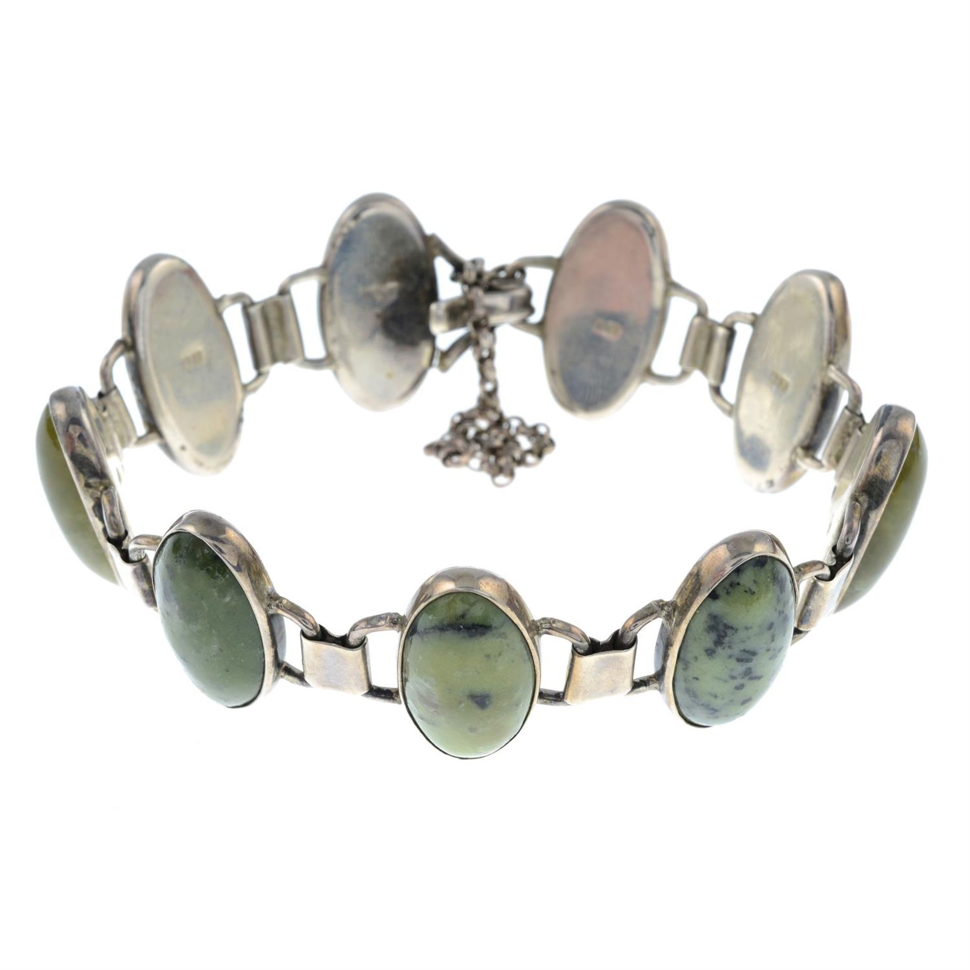 A silver nephrite bracelet.